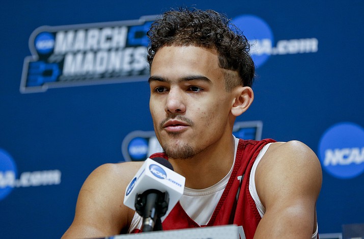 In this March 13, 2018, file photo, Oklahoma’s Trae Young answers questions during a news conference for an NCAA college basketball first round game in Pittsburgh. Young is a possible pick in Thursday’s NBA Draft. (Keith Srakocic/AP, File)