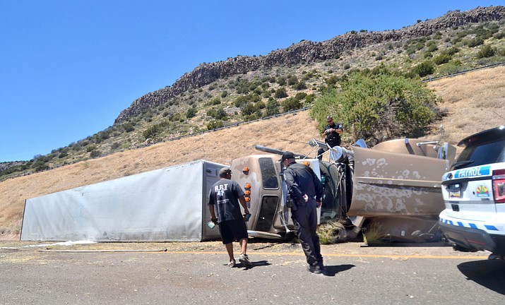 The driver and passenger of a runaway semi-trailer truck jumped from their vehicle on Interstate 17 in Camp Verde Wednesday, June 20, 2018. The passenger, 22-year-old Johnathon Hardaway of Indianapolis, was killed. The 25-year-old driver, also from Indianapolis was flown to a local hospital for treatment. The truck continued northbound for approximately a quarter mile and crashed. (Vyto Starinskas, Verde Independent)