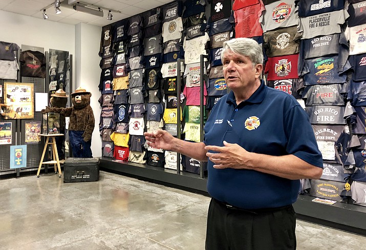 Prescott Fire Chief Dennis Light explains the history of the new Granite Mountain Interagency Hotshot Crew Learning and Tribute Center during a Monday, June 25, media preview of the center. The center, located at Prescott Gateway Mall, will open to the public at noon, Friday, June 29.