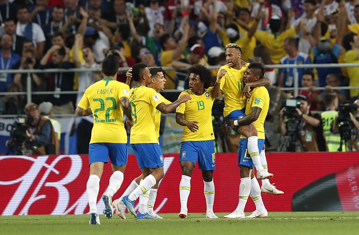 Brazil’s Paulinho, far right, celebrates with teammates after scoring his side’s first goal during the group E match between Serbia and Brazil, at the 2018 soccer World Cup in the Spartak Stadium in Moscow, Russia, Wednesday, June 27, 2018. (Rebecca Blackwell/AP Photo)