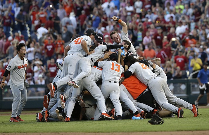 Oregon State players celebrate after they beat Arkansas 5-0 in Game 3 to win the NCAA College World Series baseball finals, Thursday, June 28, 2018, in Omaha, Neb. (Nati Harnik/AP)