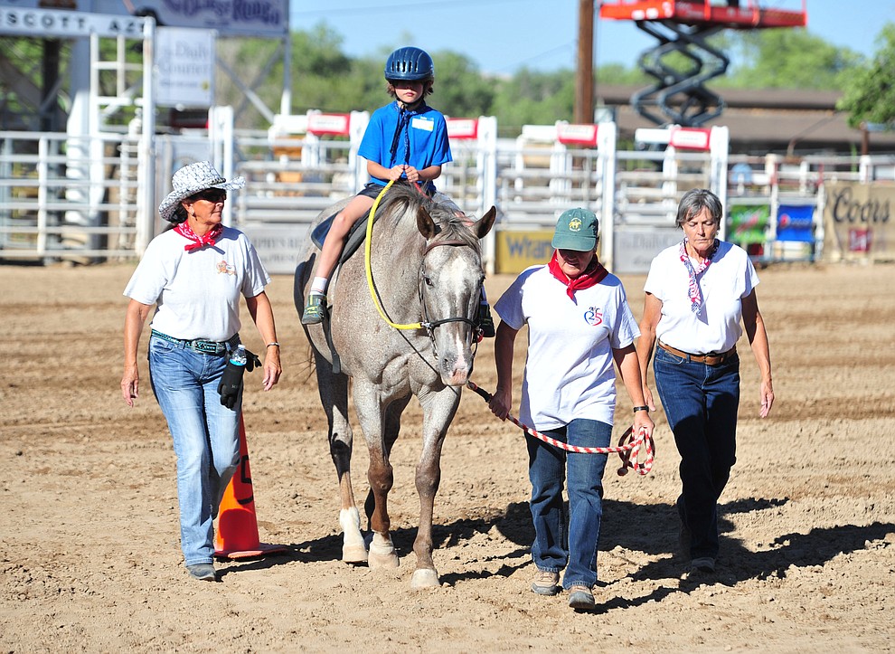 Lenux Challinor rides a horse during the Happy Hearts Rodeo for exceptional children before the opening performance of the Prescott Frontier Days Rodeo Thursday, June 28, 2018. (Les Stukenberg/Courier)