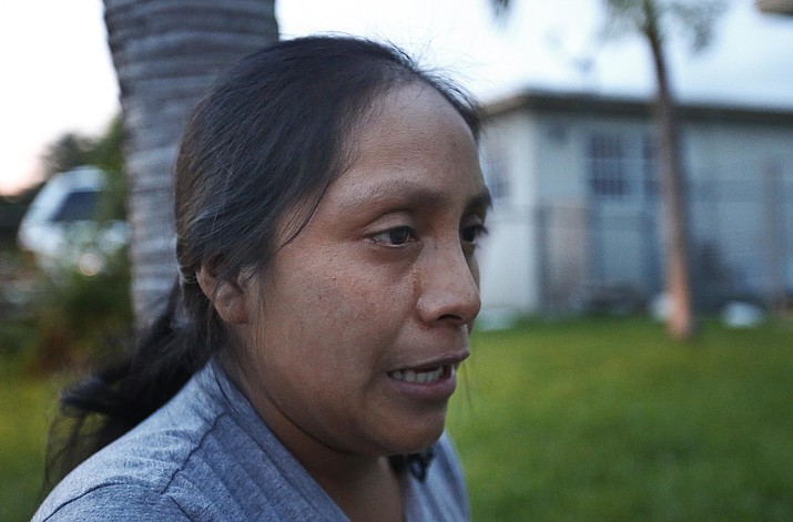 Buena Ventura Martin-Godinez, from Guatemala, cries during an interview with the Associated Press at her home in Homestead, Fla., on Wednesday, June 27, 2018, describing how much she misses her daughter, Janne, who has been detained in Michigan after crossing the U.S. border with her father. Martin didn’t get to speak to her daughter, Janne, until June 6 - three weeks after her husband was apprehended. They have spoken several times by phone in recent days. “I tell her I love her so much, to forgive me for everything that is happening,” she said, her eyes at times filling with tears. (AP Photo/Brynn Anderson)

