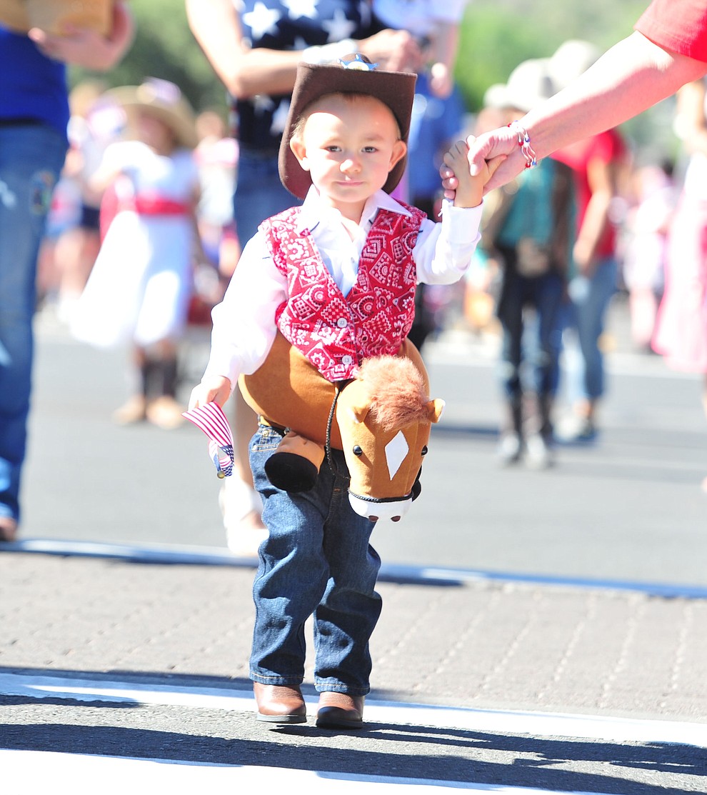 Cowboys ride in the 77th annual Kiwanis Kiddie Parade in downtown Prescott Friday, June 29, 2018.(Les Stukenberg/Courier)