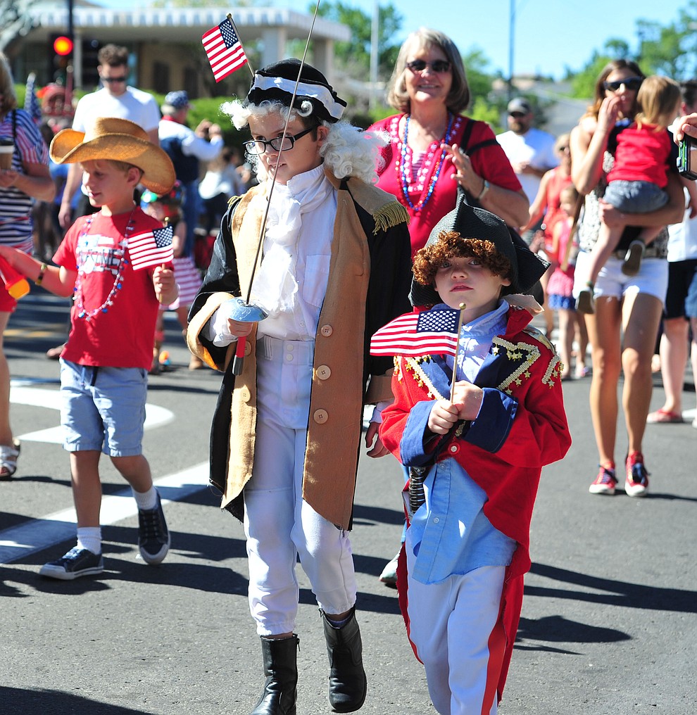 Historical characters march during the 77th annual Kiwanis Kiddie Parade in downtown Prescott Friday, June 29, 2018.(Les Stukenberg/Courier)
