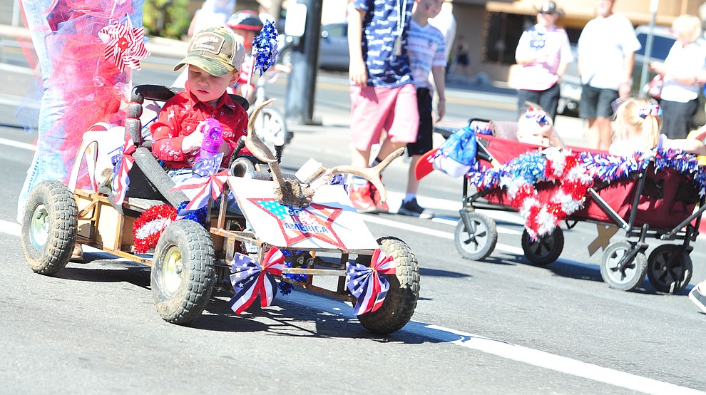 Some children get to ride during the 77th annual Kiwanis Kiddie Parade in downtown Prescott Friday, June 29, 2018.(Les Stukenberg/Courier)