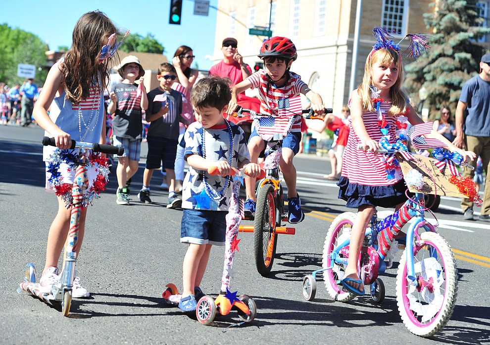Patriotic scooters and bikes during the 77th annual Kiwanis Kiddie Parade in downtown Prescott Friday, June 29, 2018.(Les Stukenberg/Courier)