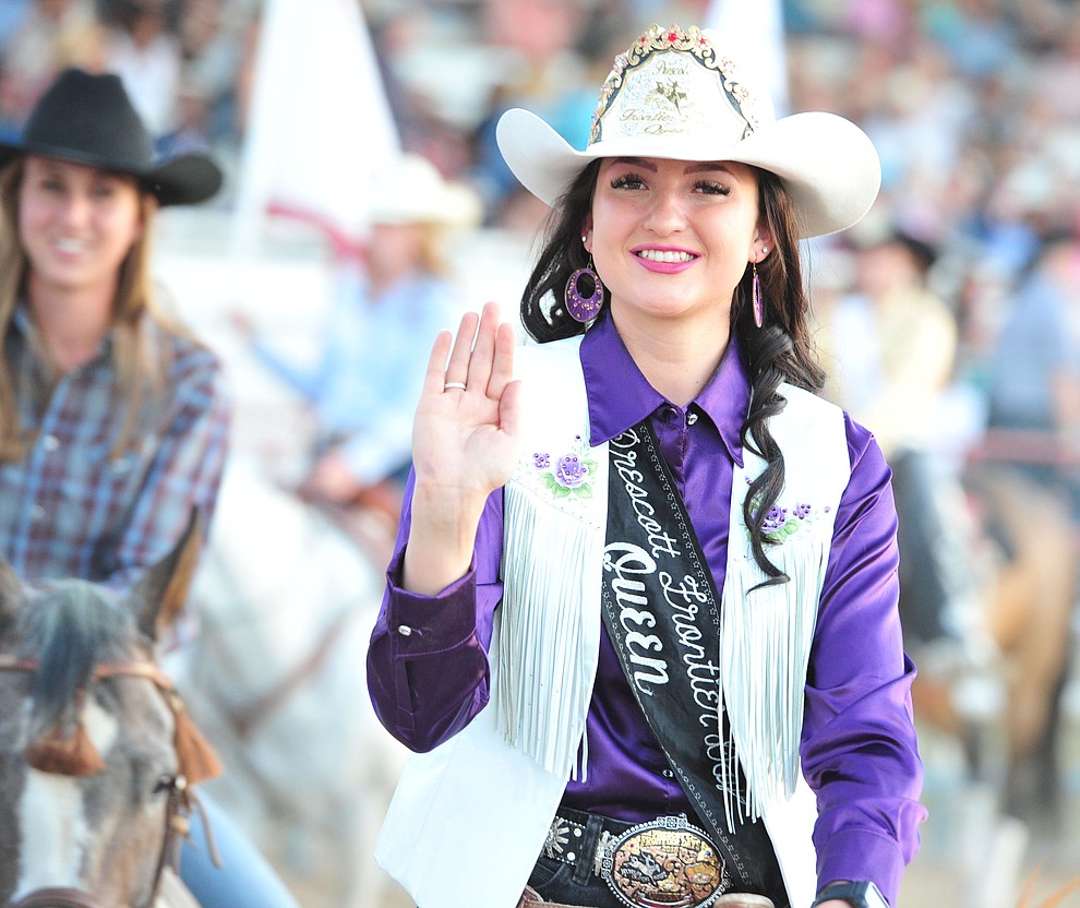 Prescott Frontier Days Queen Sarah Grant rides in the grand entry during the opening performance of the Prescott Frontier Days Rodeo Thursday, June 28, 2018. (Les Stukenberg/Courier)