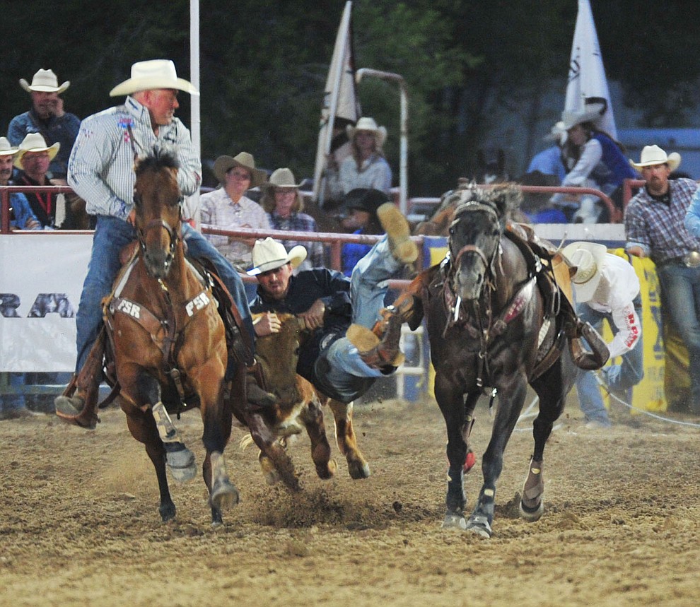 Ross Mosher had a 5.2 second run in the steer wrestling during the opening performance of the Prescott Frontier Days Rodeo Thursday, June 28, 2018. (Les Stukenberg/Courier)