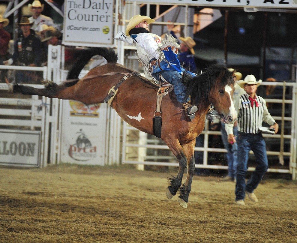Seth Hardwick scored 78 on Spicy Chicken in the bareback during the opening performance of the Prescott Frontier Days Rodeo Thursday, June 28, 2018. (Les Stukenberg/Courier)