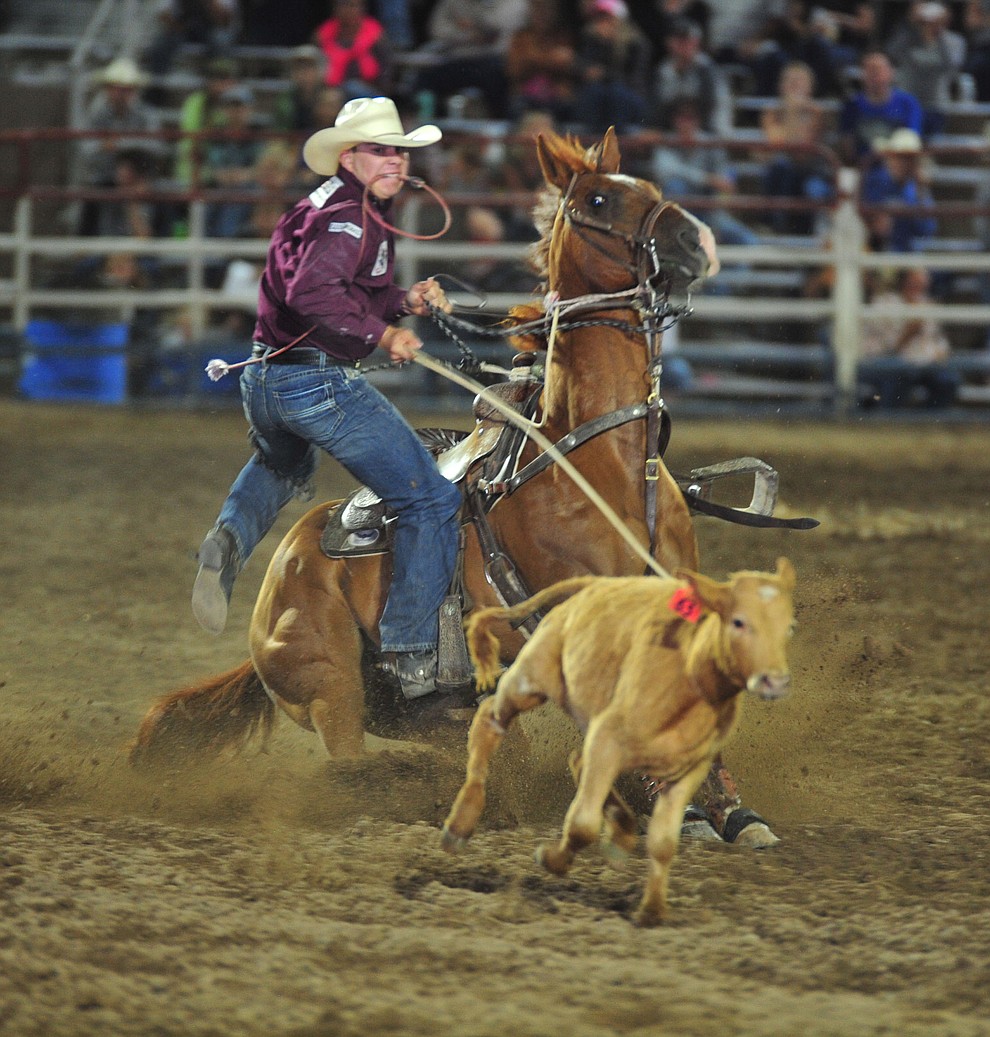 Westyn Hughes ropes his calf in 10.4 seconds the tie down roping during the opening performance of the Prescott Frontier Days Rodeo Thursday, June 28, 2018. (Les Stukenberg/Courier)