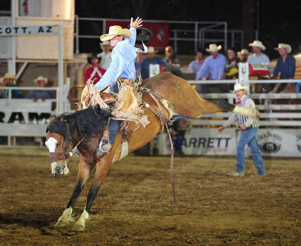 Jake Barnes rides I'ma Be for a score of 74 in the saddle bronc during the opening performance of the Prescott Frontier Days Rodeo Thursday, June 28, 2018. (Les Stukenberg/Courier)
