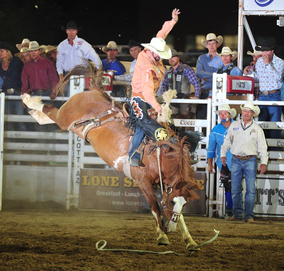 Wade Sundell rides Sombrero for a score of 82.5 in the saddle bronc during the opening performance of the Prescott Frontier Days Rodeo Thursday, June 28, 2018. (Les Stukenberg/Courier)