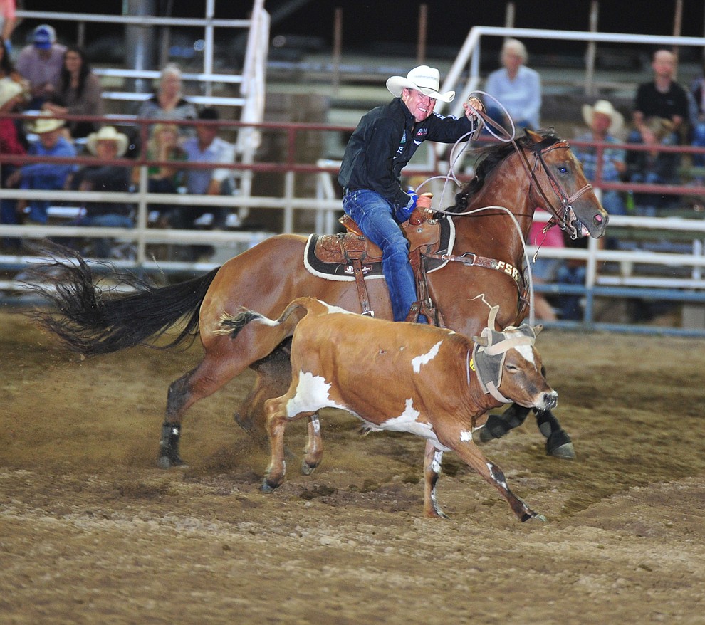 Trevor Brazile ropes his steer in the team roping during the opening performance of the Prescott Frontier Days Rodeo Thursday, June 28, 2018. (Les Stukenberg/Courier)
