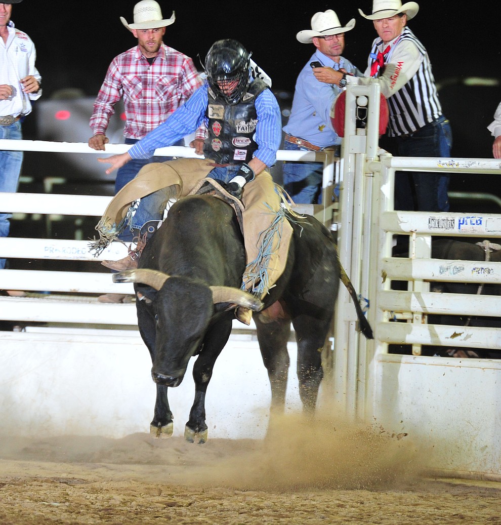 Scottie Knapp on Blown Away in the bull riding during the opening performance of the Prescott Frontier Days Rodeo Thursday, June 28, 2018. (Les Stukenberg/Courier)