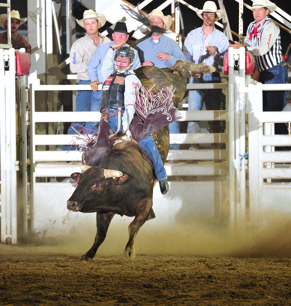 Ty Wallace scored 80 on Cowboyd in the bull riding during the opening performance of the Prescott Frontier Days Rodeo Thursday, June 28, 2018. (Les Stukenberg/Courier)