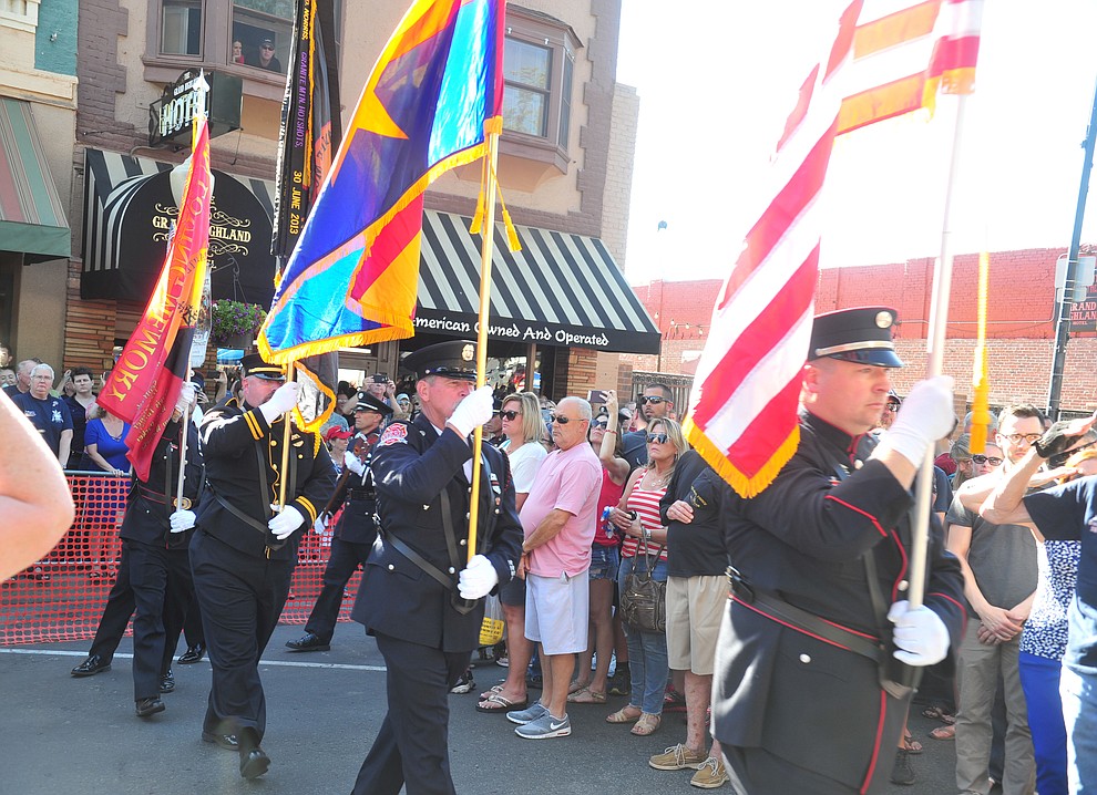 A joint fire service honor guard posts the colors during a Remembrance Ceremony for the 19 Granite Mountain Hotshots Saturday, June 30, 2018 on Montezuma Street in downtown Prescott.(Les Stukenberg/Courier)