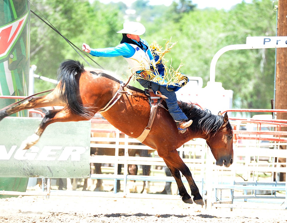 Jamie Howlett on John Boy in the bareback during the third performance of the Prescott Frontier Days Rodeo Saturday, June 30, 2018.(Les Stukenberg/Courier)