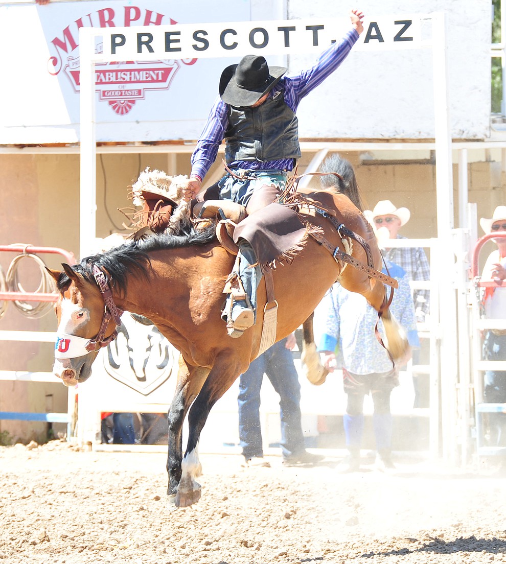 Corey Lefebre scores 64 on Ricochay in the saddle bronc riding during the third performance of the Prescott Frontier Days Rodeo Saturday, June 30, 2018.(Les Stukenberg/Courier)