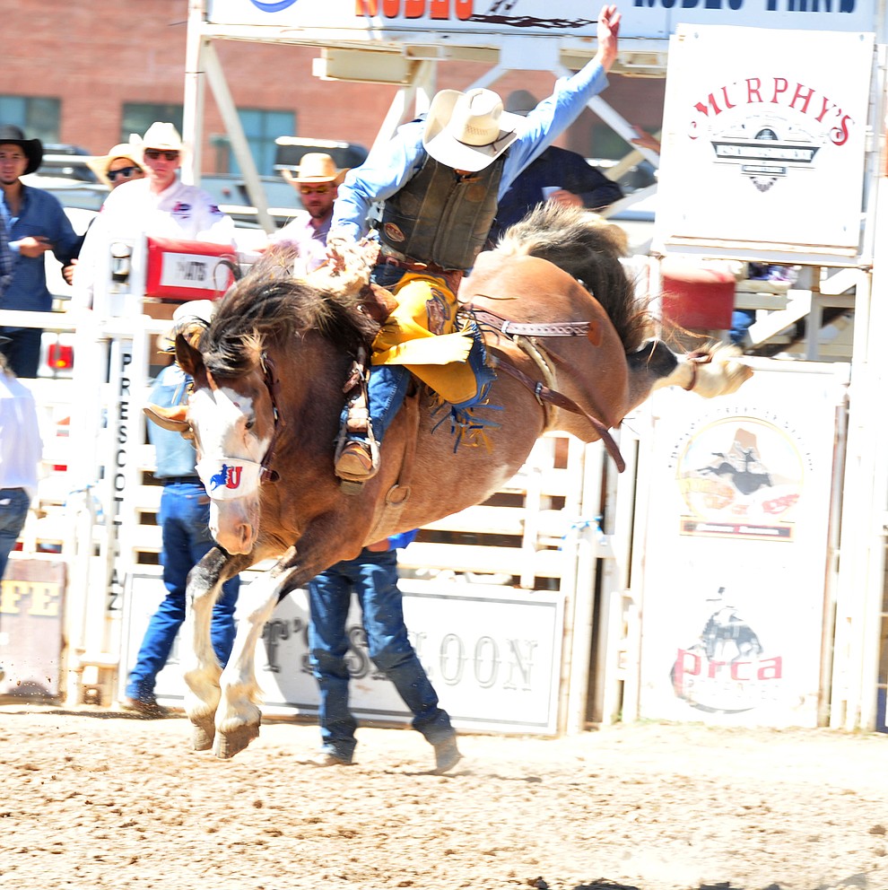Dean Wadsworth scores on Raise Your Glass in the saddle bronc riding during the third performance of the Prescott Frontier Days Rodeo Saturday, June 30, 2018.(Les Stukenberg/Courier)