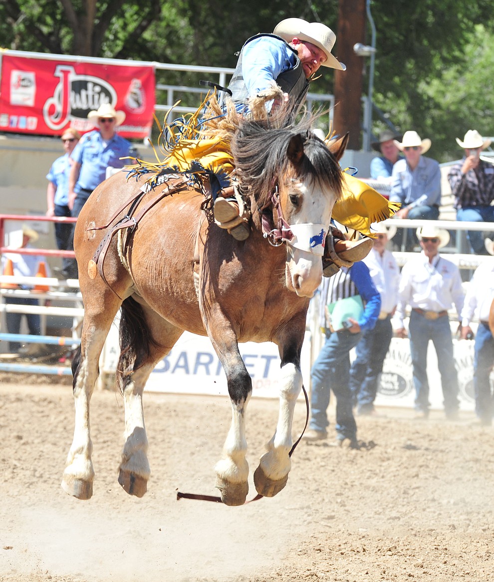 Dean Wadsworth scores on Raise Your Glass in the saddle bronc riding during the third performance of the Prescott Frontier Days Rodeo Saturday, June 30, 2018.(Les Stukenberg/Courier)