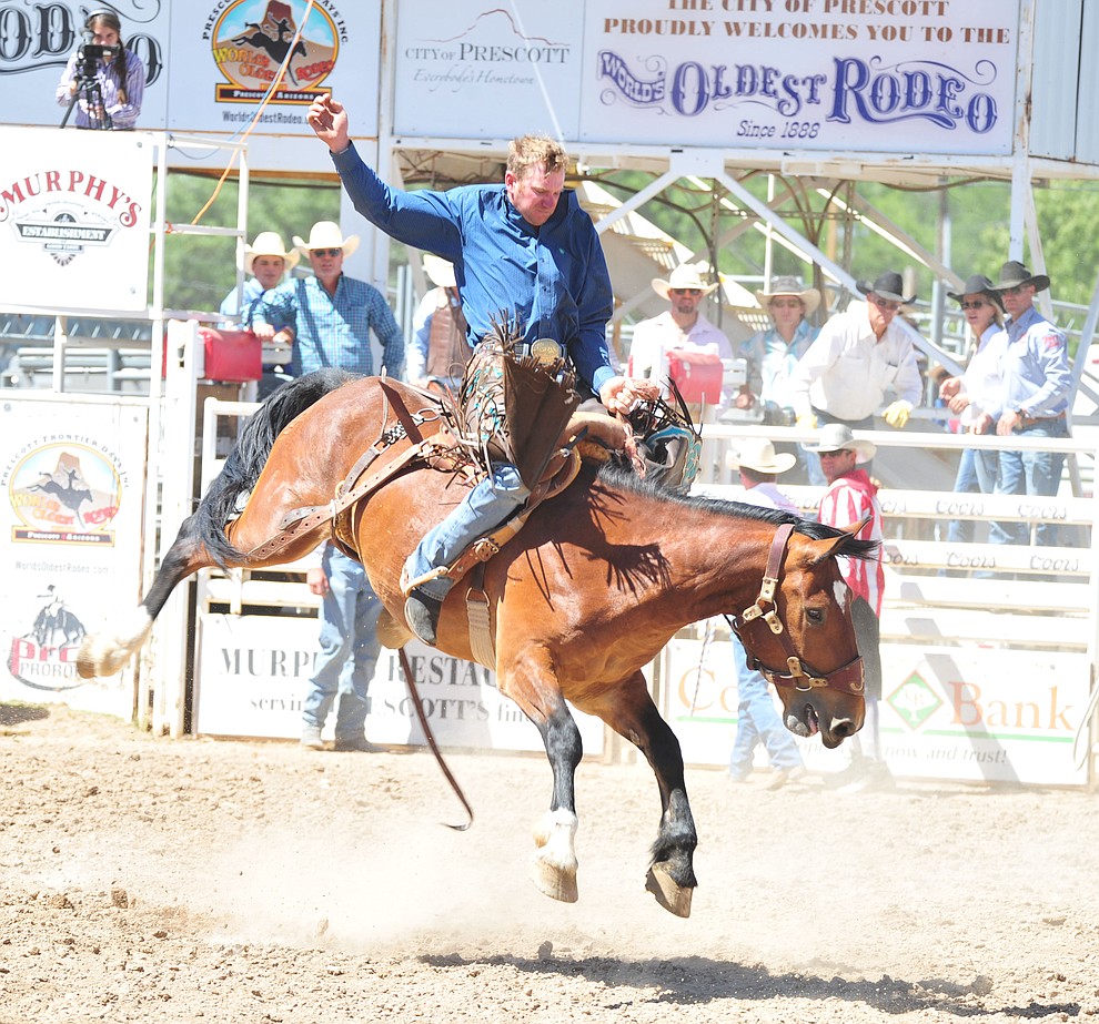 Chad Shaw on Long Ago in the saddle bronc riding during the third performance of the Prescott Frontier Days Rodeo Saturday, June 30, 2018.(Les Stukenberg/Courier)