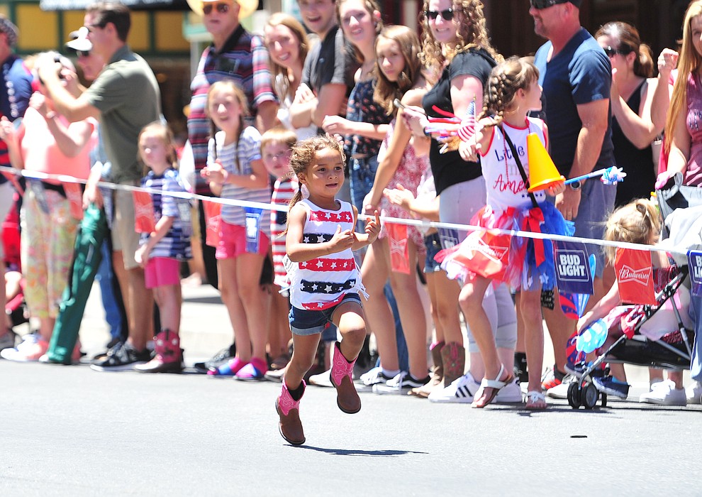 Tylena Garcia runs alone in the lead in the first heat of the three and under race during 36th annual Whiskey Row Boot Race along Montezuma Street in downtown Prescott Saturday, June 30, 2018.(Les Stukenberg/Courier)
