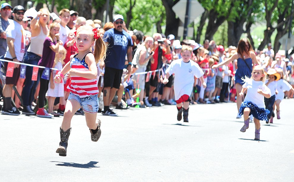 Kaizlee Carrillo is flaoting along in the four to five year old race during 36th annual Whiskey Row Boot Race along Montezuma Street in downtown Prescott Saturday, June 30, 2018.(Les Stukenberg/Courier)