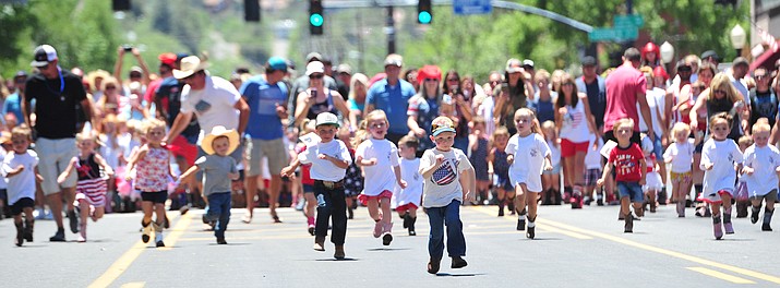 Shepherd Young has the lead in the second heat of the 3-year-old and under race during the 36th annual Whiskey Row Boot Race along Montezuma Street in downtown Prescott Saturday, June 30, 2018.
