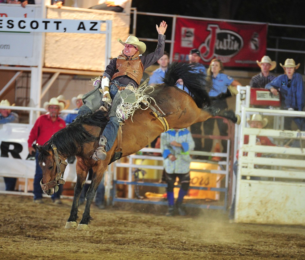 Shon Gibson scores 76 on Billy the Kid in the bareback during the 5th performance of the Prescott Frontier Days Rodeo Sunday, July 1, 2018. (Les Stukenberg/Courier)