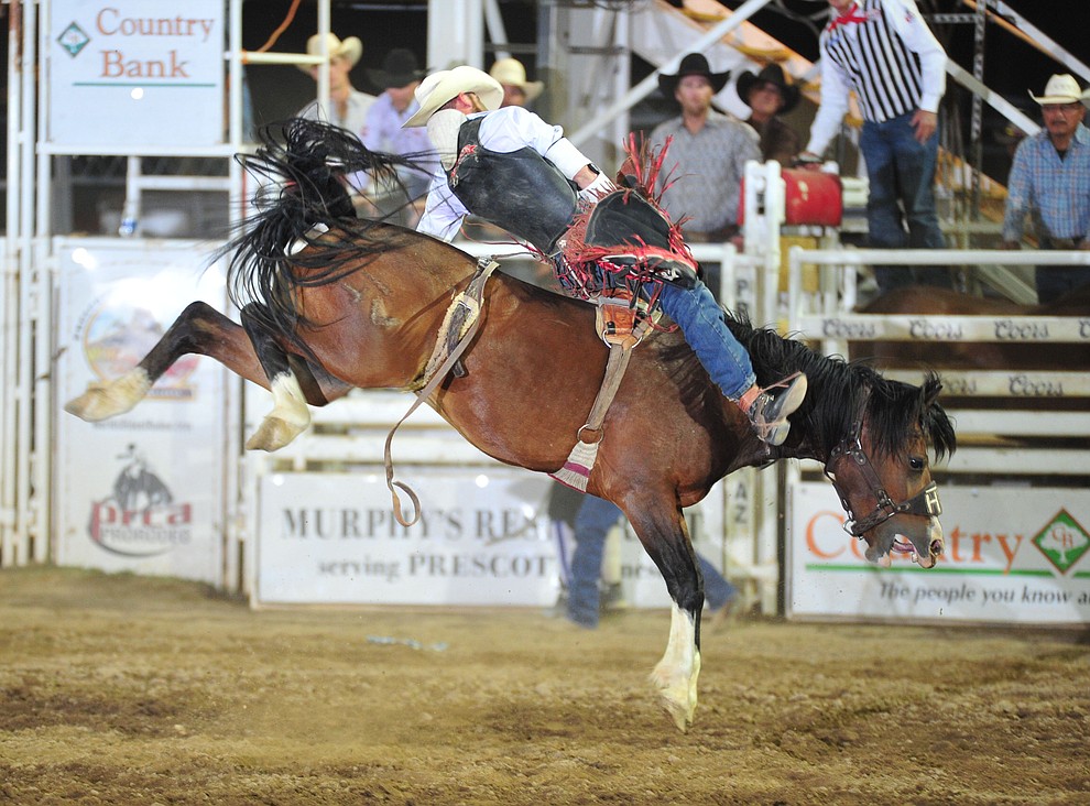 Logan Patterson scores 78 on Hot Valley in the bareback during the 5th performance of the Prescott Frontier Days Rodeo Sunday, July 1, 2018. (Les Stukenberg/Courier)