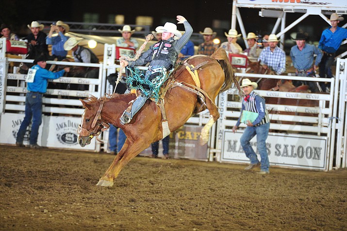 Jacobs Crawley scores 79 on Ring Binder in the saddle bronc during the second performance of the Prescott Frontier Days Rodeo Friday, June 29, 2018.(Les Stukenberg/Courier)