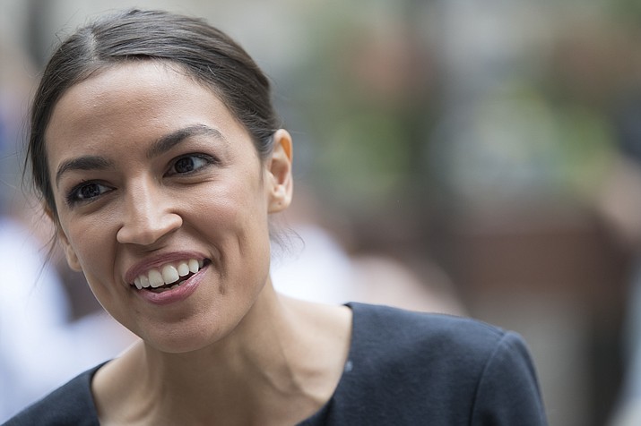 In this June 27, 2018 photo, Alexandria Ocasio-Cortez, is photographed while being interviewed in Rockefeller Center in New York. Ready or not, change is coming to the House Democrats. Across the country, a new generation of Democrats is making its way to Washington. (AP Photo/Mary Altaffer)

