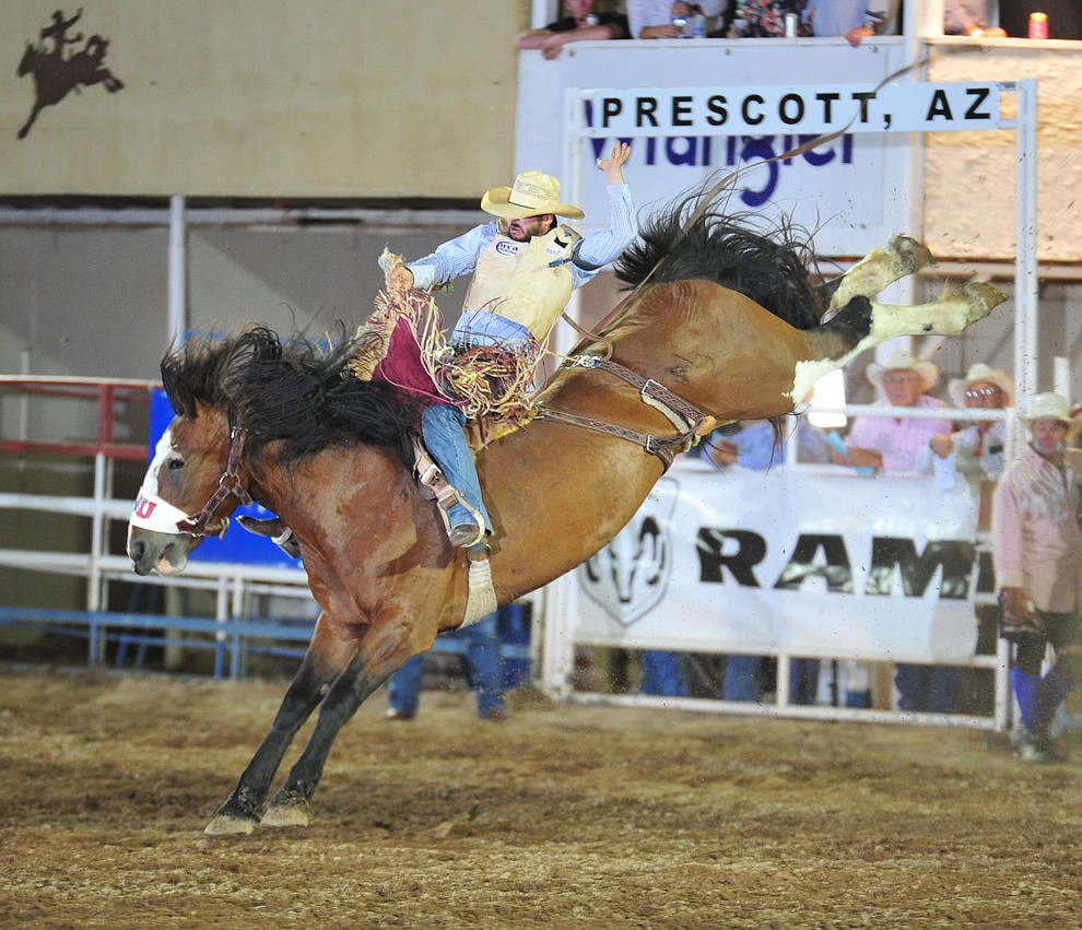 Mason Laviolette scores 80.5 on Big Valley in the saddle bronc during the 6th performance of the Prescott Frontier Days Rodeo Monday, July 2, 2018. (Les Stukenberg/Courier)