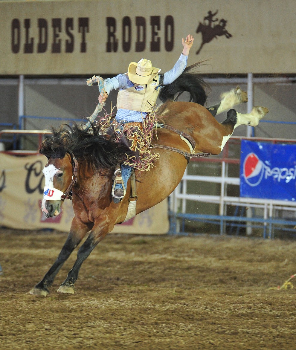 Mason Laviolette scores 80.5 on Big Valley in the saddle bronc during the 6th performance of the Prescott Frontier Days Rodeo Monday, July 2, 2018. (Les Stukenberg/Courier)