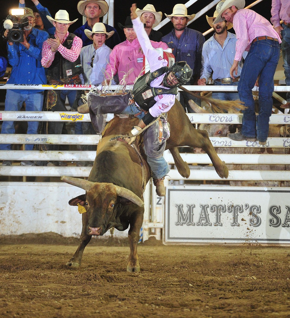 Tim Bingham scores 89.5 on Monte Walsh to take the overall lead in the bull riding during the 6th performance of the Prescott Frontier Days Rodeo Monday, July 2, 2018. (Les Stukenberg/Courier)