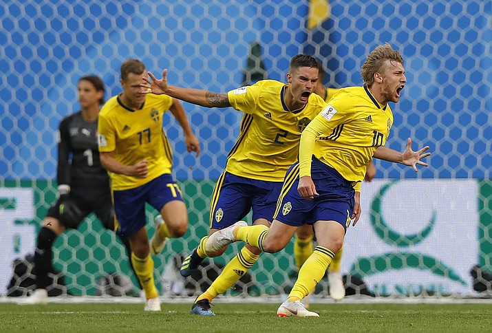 Sweden’s Emil Forsberg, right, celebrates with teammates after scoring the opening goal during the round of 16 match between Switzerland and Sweden at the 2018 soccer World Cup in the St. Petersburg Stadium, in St. Petersburg, Russia, Tuesday, July 3, 2018. (Darko Bandic/AP)