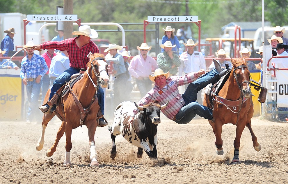 Wyatt Smith in the steer wrestling during the final performance of the 2018 Prescott Frontier Days Rodeo Wednesday, July 4, 2018. (Les Stukenberg/Courier)