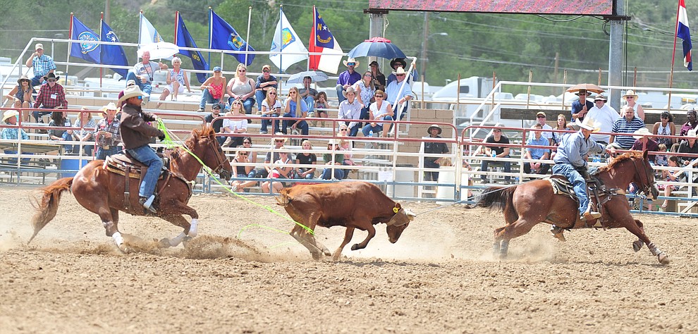Josh Siggins and Victor Aros in the team roping during the final performance of the 2018 Prescott Frontier Days Rodeo Wednesday, July 4, 2018. (Les Stukenberg/Courier)