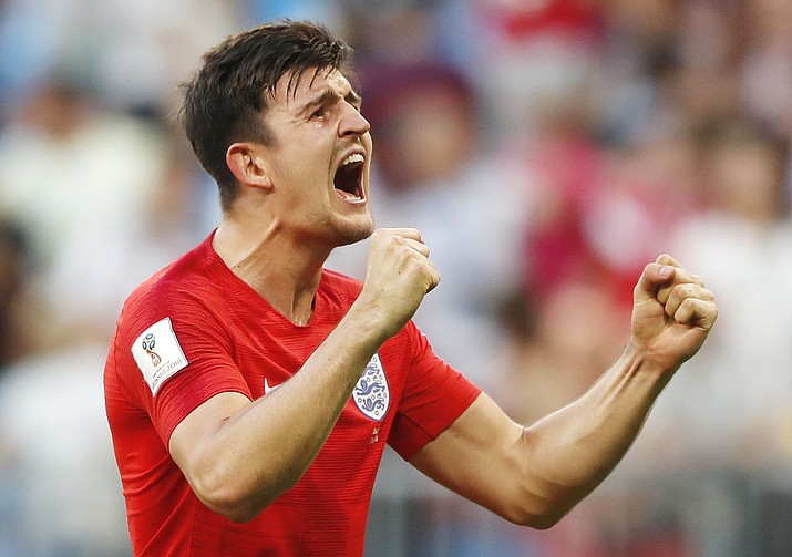 England's Harry Maguire celebrates victory of his team over Sweden during the quarterfinal match between Sweden and England at the 2018 soccer World Cup in the Samara Arena, in Samara, Russia, Saturday, July 7, 2018. (Frank Augstein/AP)