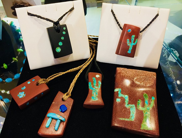 Cheston Trammel's handcrafted “Arizona Spirit Bundles” are adorned with hand-carved  pendants inlaid with turquoise and lapis. Prayers and blessing are woven into each of these pieces. His distinctive and comfortable work is prized and worn by both men and women.   
