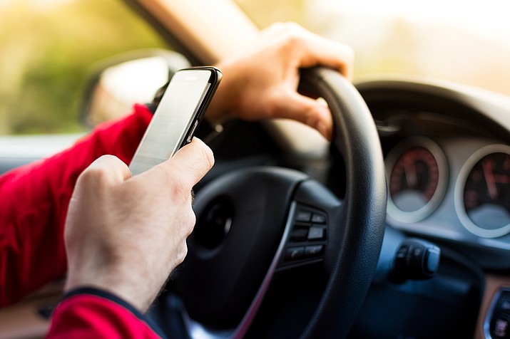 Under a new law, teens can be fined for texting while driving within the first six months of gaining their license. (Stock photo)