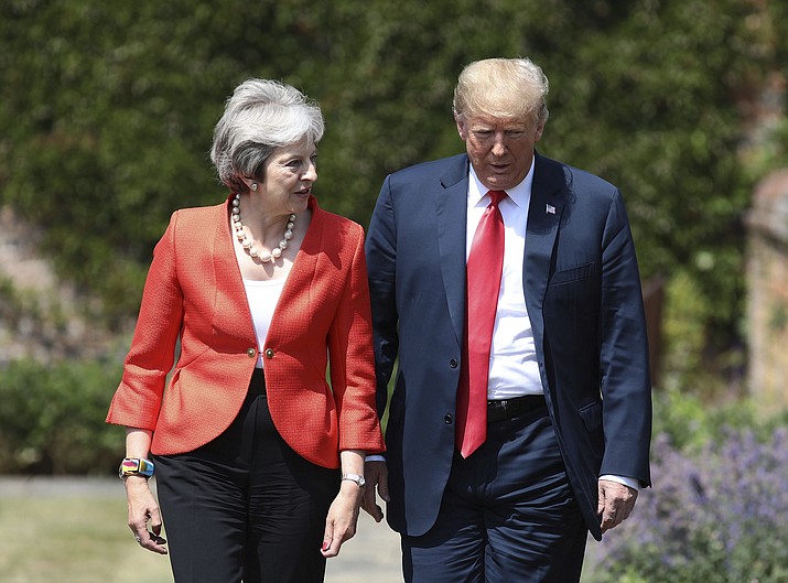British Prime Minister Theresa May walks with U.S President Donald Trump prior to a joint press conference at Chequers, in Buckinghamshire, England, Friday, July 13, 2018. (Jack Taylor/Pool Photo via AP)

