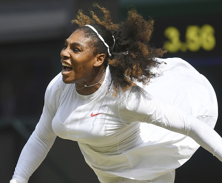 Serena Williams serves to Julia Goerges during their women’s semifinal match at the Wimbledon Tennis Championships in London. (Neil Hall/Pool via AP)