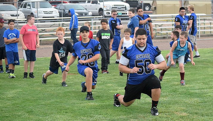 Camp Verde High School players and campers warm up at the Cowboys’ youth football camp in 2016. CVHS and Camp Verde Youth Football & Cheer will put on the camp this Tuesday through Thursday. VVN file photo
