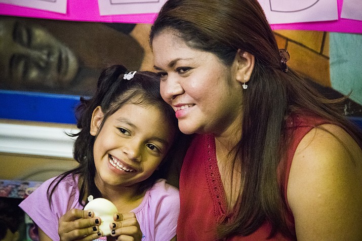 Allison, 6, and her mother Cindy Madrid share a moment during a news conference, Friday, July 13, 2018, in Houston. The press conference, the mother and daughter spoke about the month and one day they were separated under the President Donald Trump administration immigration policy that has separated families attempting to claim asylum in the United States. (Marie D. De Jes's/Houston Chronicle via AP)


