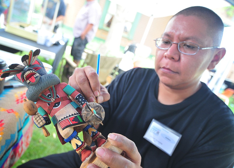 Donald Sockyma paints a Hopi Kachina at the 21st annual Indian Arts Market at the Sharlot Hall Museum Saturday, July 14, 2018. The market continues today from 9:00 - 4:00. (Les Stukenberg/Courier)