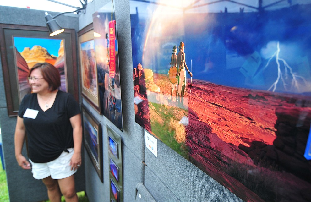 Photographer Priscilla Tacheny at the 21st annual Indian Arts Market at the Sharlot Hall Museum Saturday, July 14, 2018. The market continues today from 9:00 - 4:00. (Les Stukenberg/Courier)