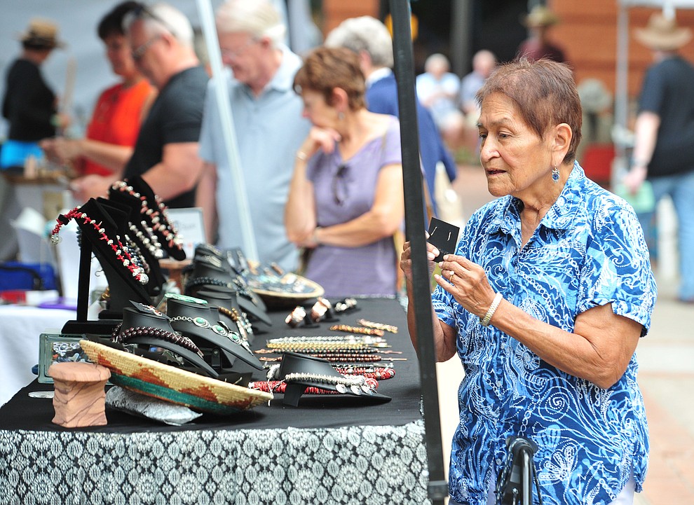 Salt River Pima Romona  Loring shops for jewelry at the 21st annual Indian Arts Market at the Sharlot Hall Museum Saturday, July 14, 2018. The market continues today from 9:00 - 4:00. (Les Stukenberg/Courier)