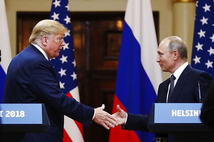 U.S. President Donald Trump shakes hand with Russian President Vladimir Putin at the end of the press conference after their meeting at the Presidential Palace in Helsinki, Finland, Monday, July 16, 2018. (AP Photo/Alexander Zemlianichenko)

